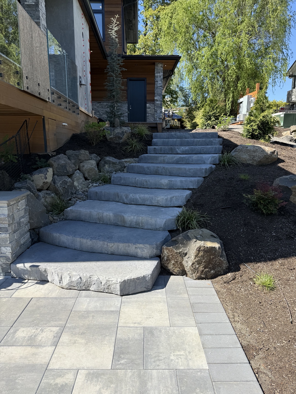 Featured Garden City Landscapes poolside hardscape project